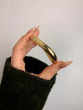 tiny gold curve bangle